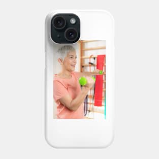 Senior woman exercising with dumbbells (F024/9971) Phone Case