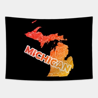 Colorful mandala art map of Michigan with text in red and orange Tapestry