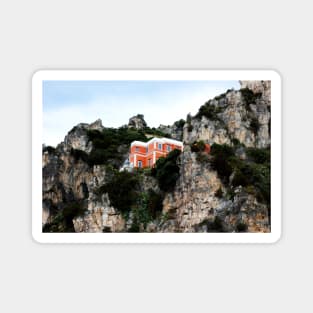 View of a red and white building with lighthouse perching on a cliff in the Amalfi coast Magnet