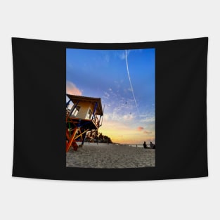 A sun-drenched beach with a crystal-clear ocean stretching out to the horizon. Tapestry