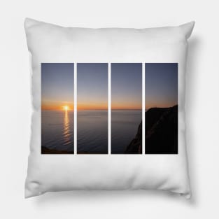 Wonderful landscapes in Norway. Nord-Norge. Beautiful scenery of a midnight sun sunset at Nordkapp (Cape North). Boat and globe on a cliff. Rippled sea and clear orange sky. Pillow