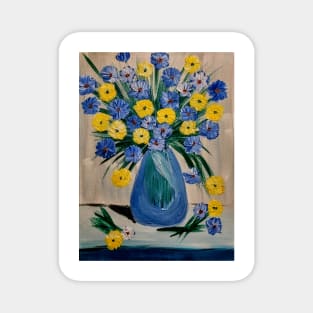 Some blue and yellow carnations ins glass vase Magnet