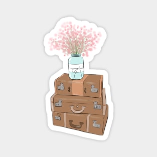 Pile of baggage with a jar with flowers Magnet