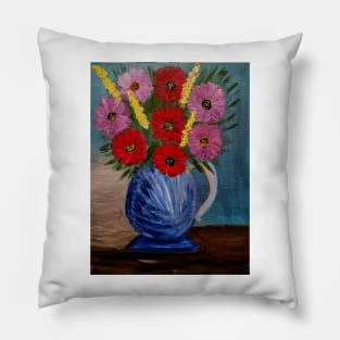 Some beautiful mixed flowers im a metallic blue jug vase . Pillow