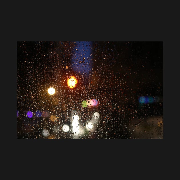 Deatil of raindrops on a car windshield at night by Reinvention