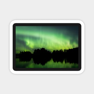 Northern lights glowing over lake in Finland Magnet