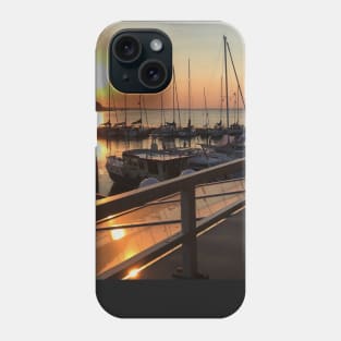 Peaceful sunset over marina with sailboat mast on Baltic sea in Langballig yachting harbor, Schleswig- Flensburg, Germany Phone Case