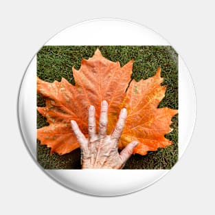 Autumn leaf and hand Pin