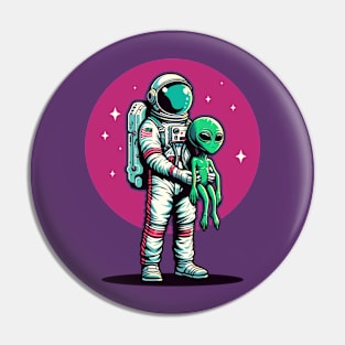 Astronaut carrying a green baby alien Pin