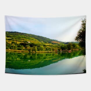 Classic panorama with Marche hilly landscape, emerald waters of the lake, tree silhouette and lush vegetation Tapestry