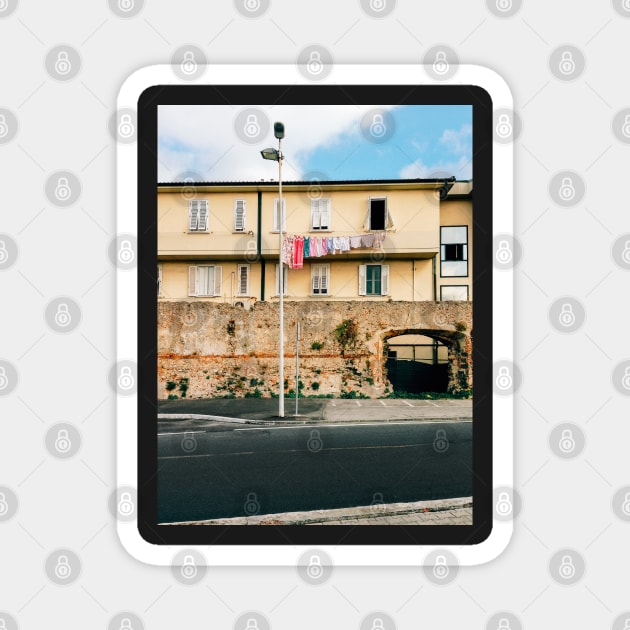 Yellow Residential Building in Italy With Drying Laundry on Washing Line Magnet by visualspectrum