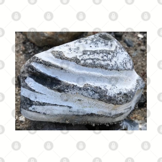 Close-up of beautiful layered triangular stone rock in white and grey stripes by Khala