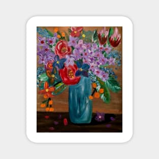 Some mixed vibrant flowers in a glass vase . Magnet