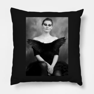 Ballet dancer sitting in Black Swan style costume. Pillow