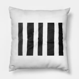 Black and white striped cloth laid out roughly to provide vetical blank lines. Pillow