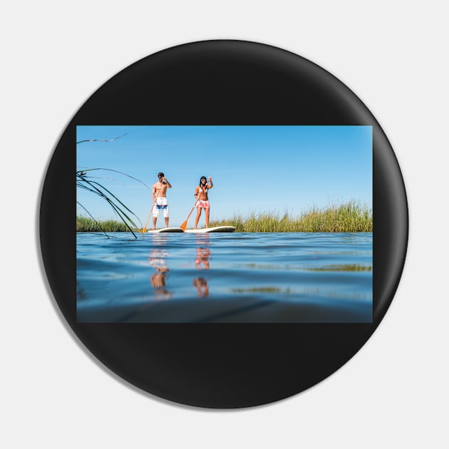 Man and woman stand up paddleboarding Pin by homydesign