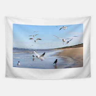 Flock of seagulls flying above the water Tapestry