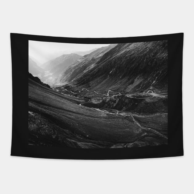 Black and White Shot of Swiss Alpine Road Winding Through Valley Tapestry by visualspectrum