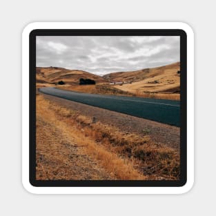 Road Through Barren Countryside Magnet