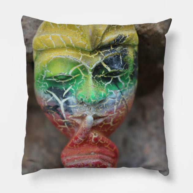 A Bali face mask with finger on its mouth. Pillow by kall3bu