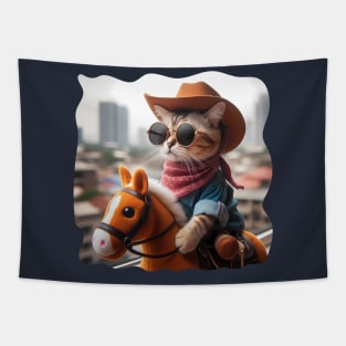 A cat wearing sunglasses and a cowboy hat riding a toy horse Tapestry