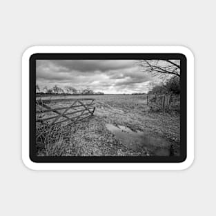 Wooden gate entrance to an arable field in the English countryside Magnet