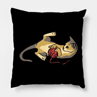 A cute cat playing with red wool Pillow