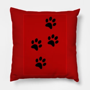 Black Pawprints on Red Pillow