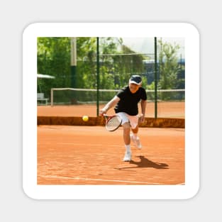 Active senior man playing tennis (F024/8848) Magnet