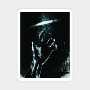 Digital collage and special processing. Person looking on his hand. Bizarre, dark. Grayscale and aquamarine. High contrast. Magnet