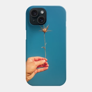 hand holding thistle Phone Case