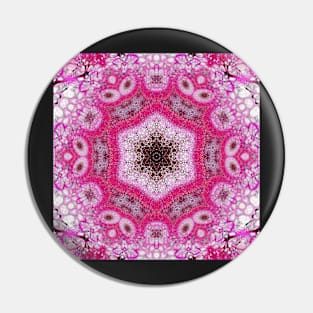 A pink snowflake-like kaleidoscope Pin