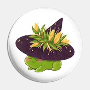 Relaxed harvest frog wearing pointy witch hat with corn Pin