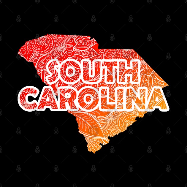 Colorful mandala art map of South Carolina with text in red and orange by Happy Citizen