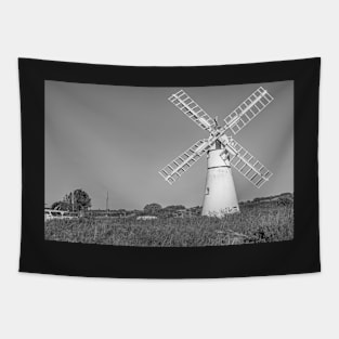 Traditional windmill on the riverbank in rural England Tapestry