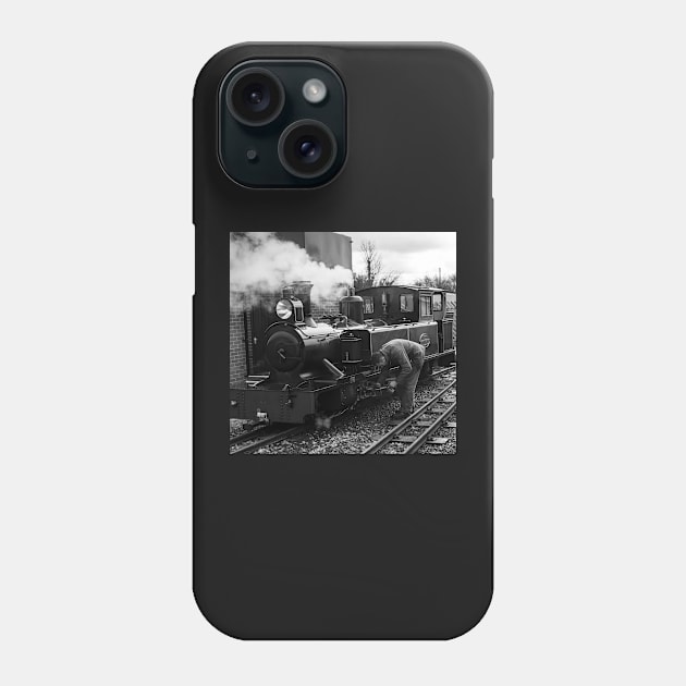 Engineer attending to a steam train on the Bure Valley Railway Phone Case by yackers1