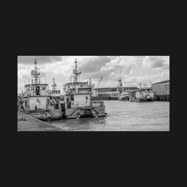 Crew transfer vessels moored up in the docks in the seaside town of Great Yarmouth, Norfolk by yackers1