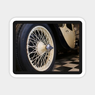 Old spoke wheel of vintage car in cream colour Magnet