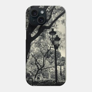 Tortured trees and a lamp post in Barcelona Phone Case