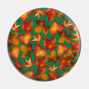 Autumn leaves on green background Pin