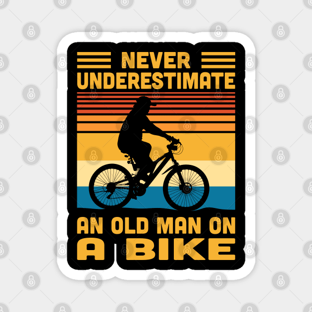 Never Underestimate An Old Man On A Bike Magnet by Vcormier