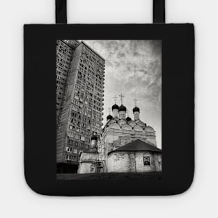 Black and white photograph of Russian orthodox church with spires and public highrise housing project in the background. Moscow, Russia Tote