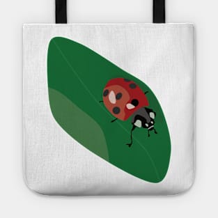 Ladybug walking on a leaf Tote