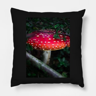 Bright red magical mushroom with white spots deep in the forest Pillow