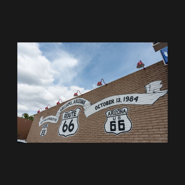 Route 66 signs on brick wall by brians101