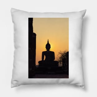 Buddha statue against sunset silhouette Pillow