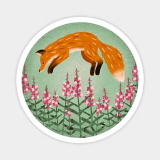 Red fox jumping in a field of fireweed flowers Magnet