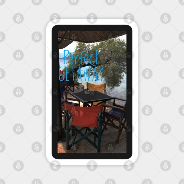 At a cafe on Mediterranean sea with text Perfect Getaway Magnet by Khala