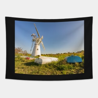 Day boats upside down on the riverbank with Thurne Mill in the background Tapestry