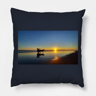 A silhouetted horse-drawn carriage on Parangtritis beach at sunset 2 Pillow